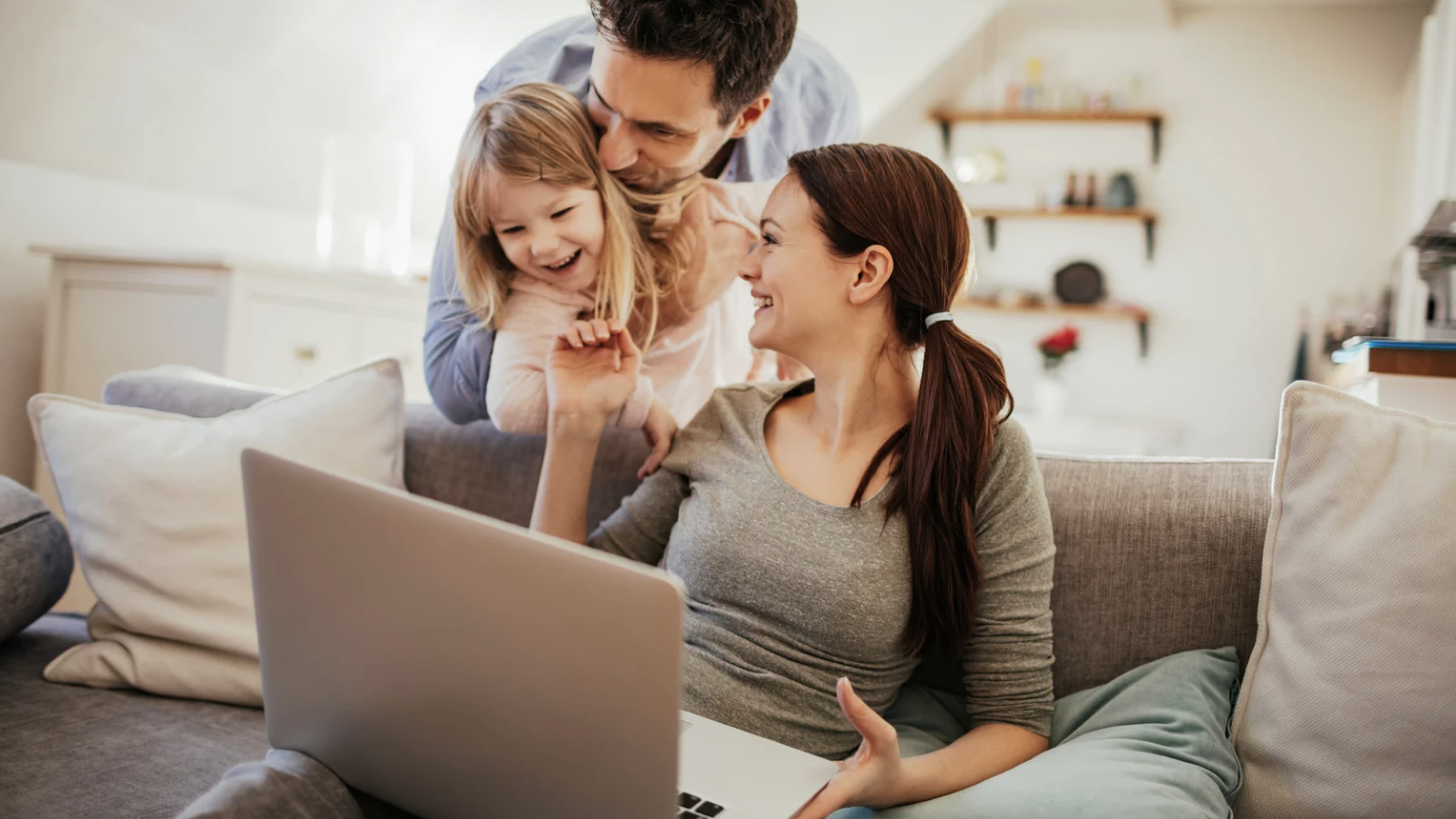 Family laughing in living room