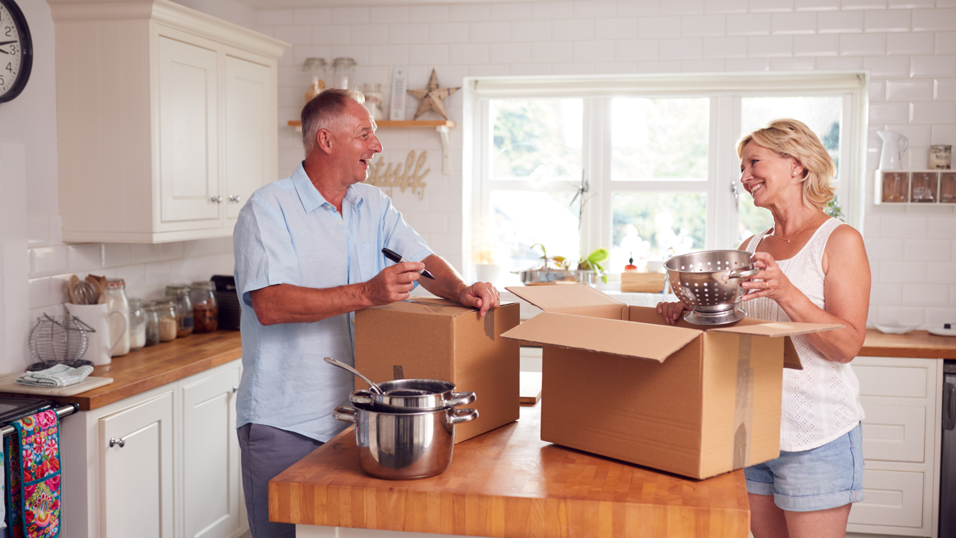 Senior couple packing up to move house
