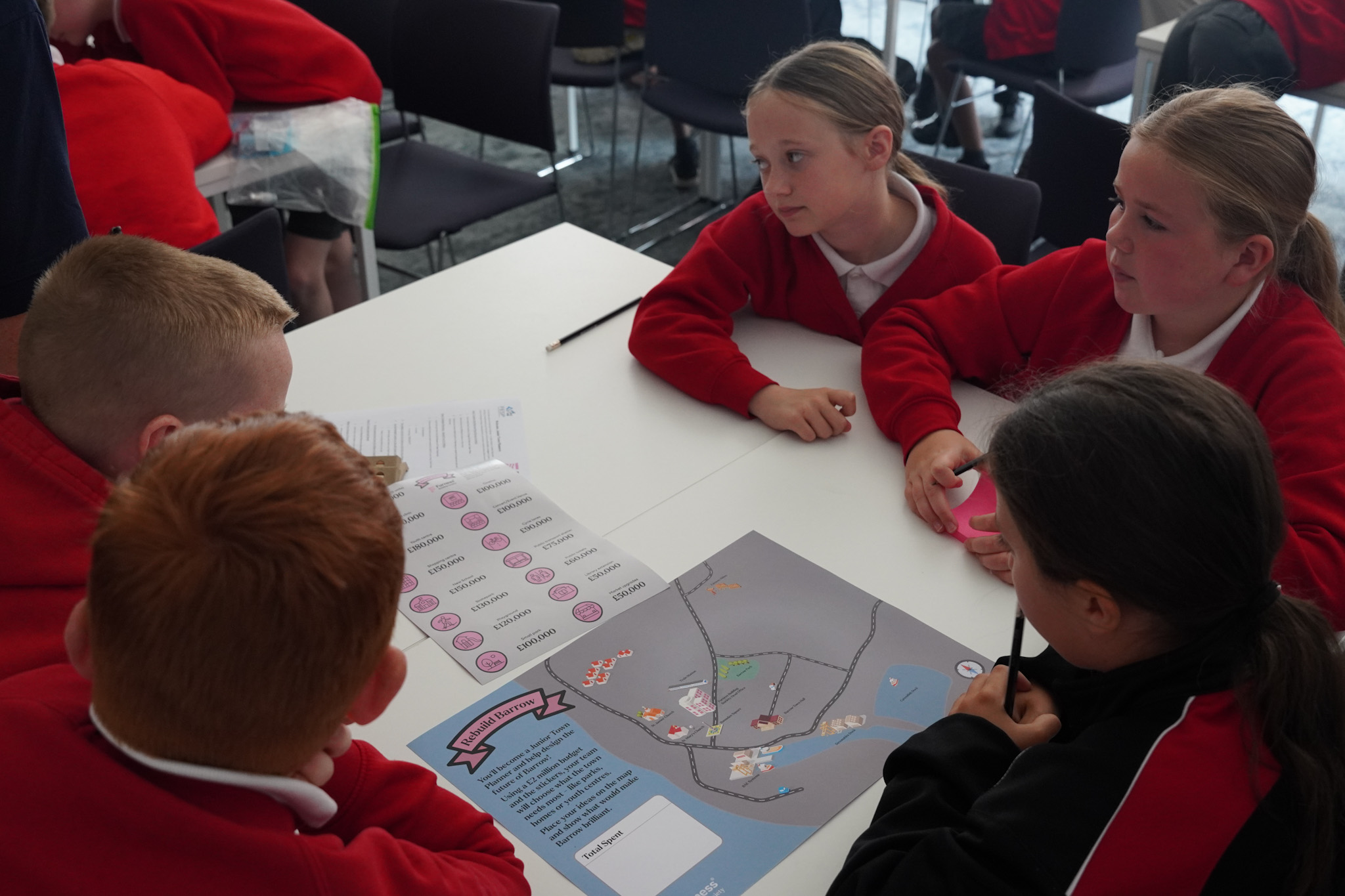 Local schoolchildren learning financial foundations