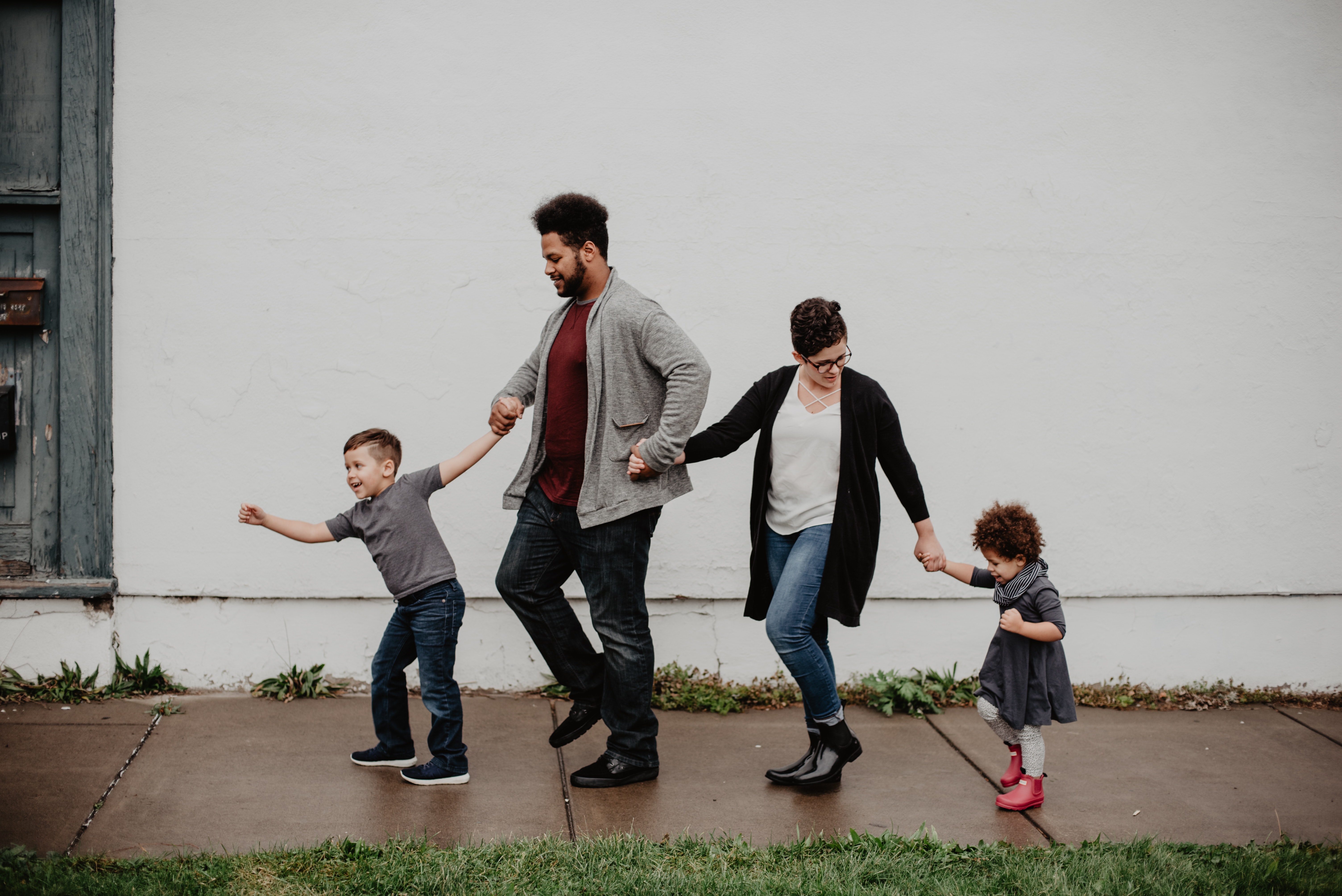 Family of 4 walking down the street